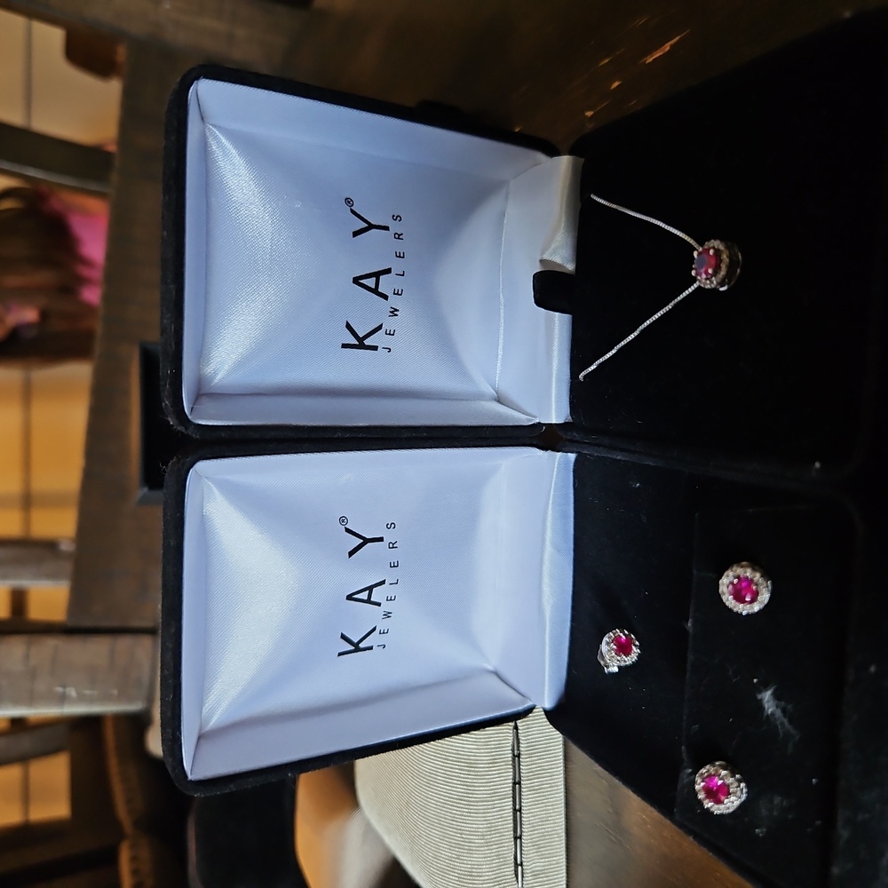 Sterling silver Ruby earrings with an extra earing and Ruby necklace to match